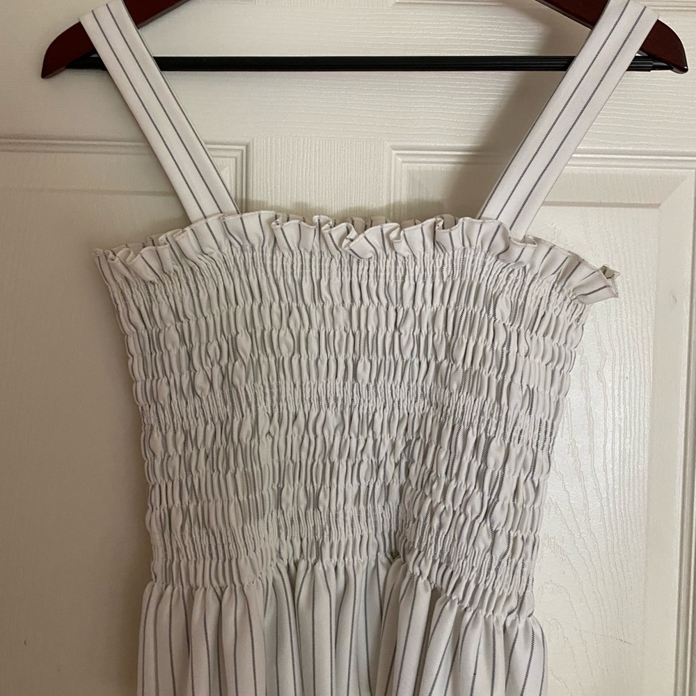 White and blue stripped top, slight peplum bottom, Alpha Omega, size S